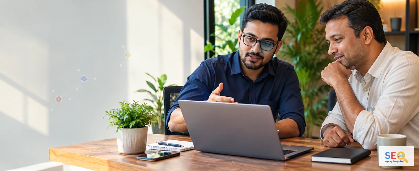 Bangladesh SEO strategist discussing keyword research and page planning with a business decision-maker
