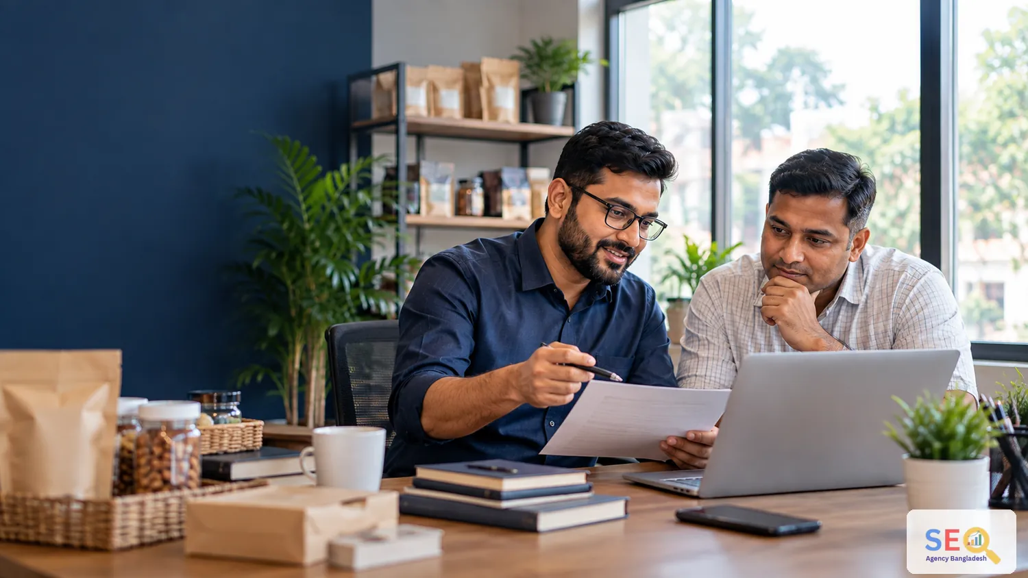 SEO consultation between a specialist and a Bangladesh small business decision-maker