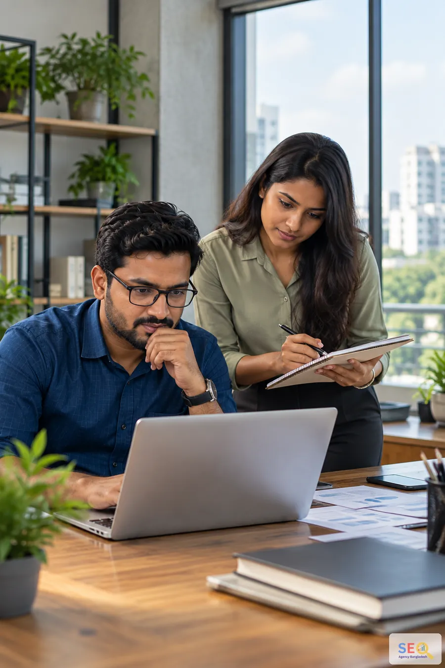 Bangladesh SEO team comparing outreach opportunities and publisher relevance on a laptop